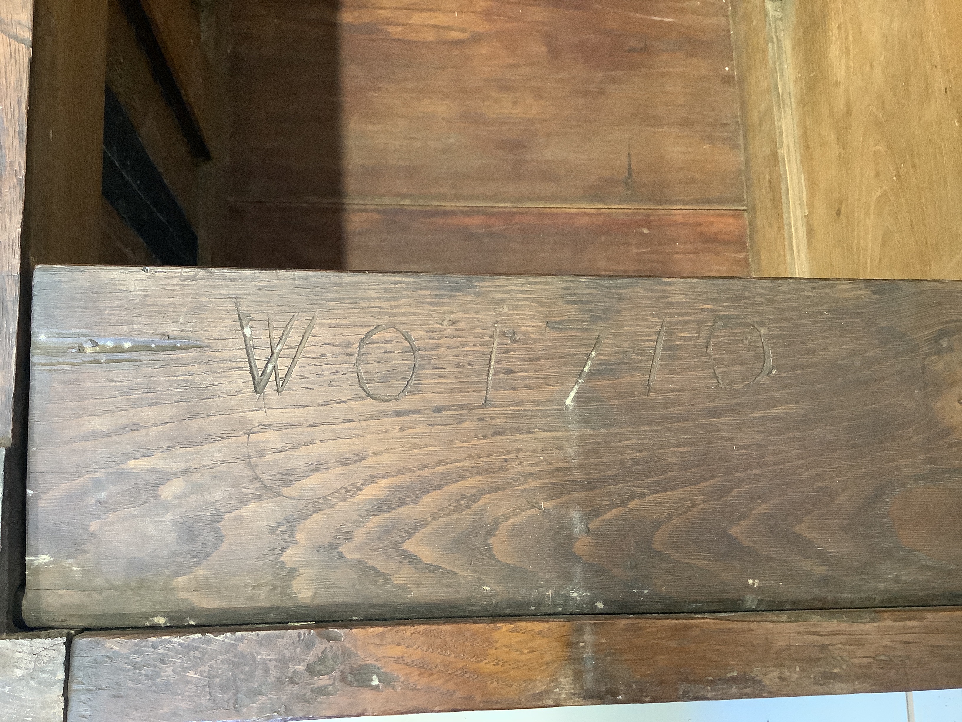 A small 17th century oak coffer with moulded geometric panelled front, width 108cm, depth 49cm, height 52cm